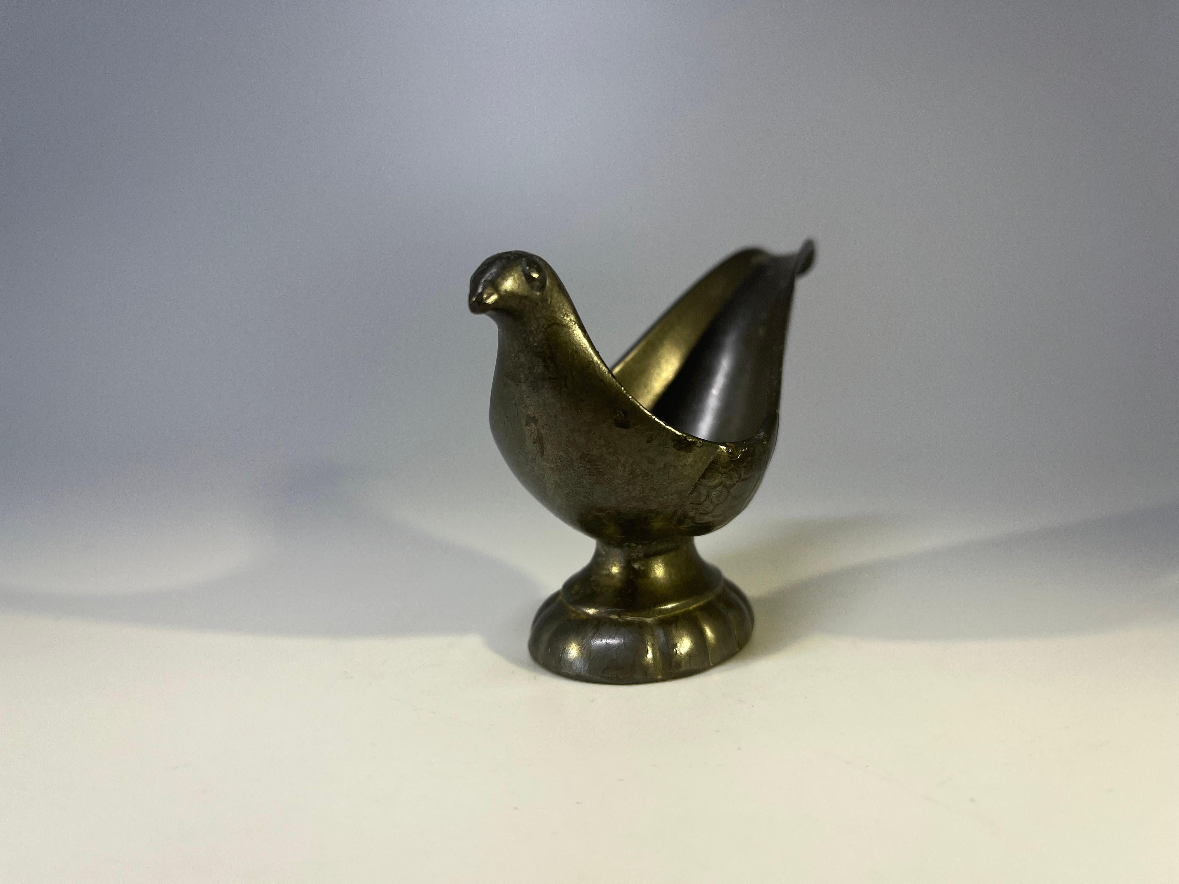 Just Andersen of Denmark, Pewter stylised bird pipe holder.
Circa 1930's.
Stamped on base.
Measures: height 2.5 inch, width 4.25 inch, depth 1.5 inch
Good condition.
Wear consistent with age and use.