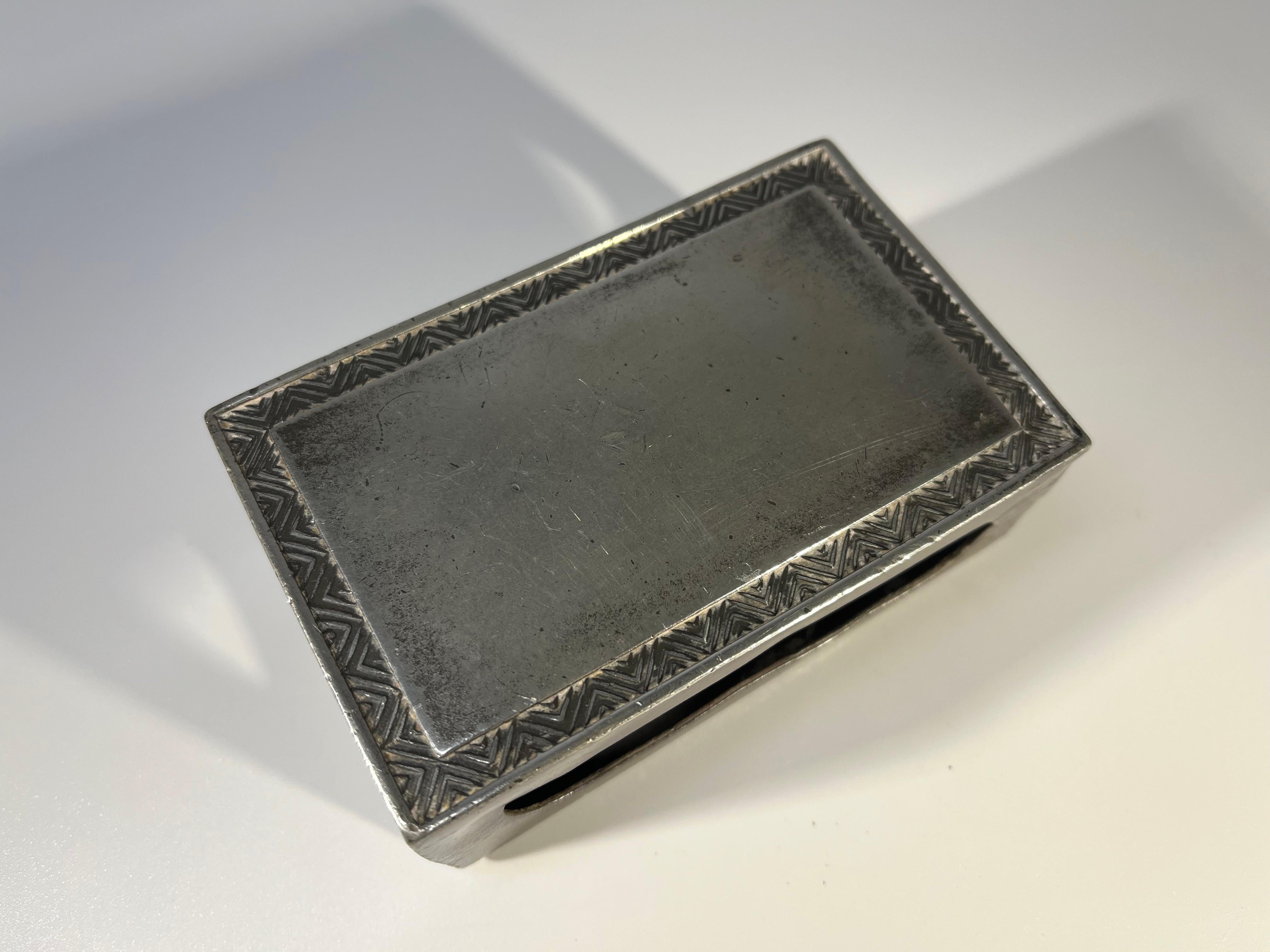 Just Andersen of Denmark, pewter stylised large match box holder
Decorative chevron patterning border
Circa 1930's
Stamped 1497 on side panel
Height 1.5 inch, Width 4 inch, Depth 2.5 inch
In good condition. Has typical patina wear
Wear consistent