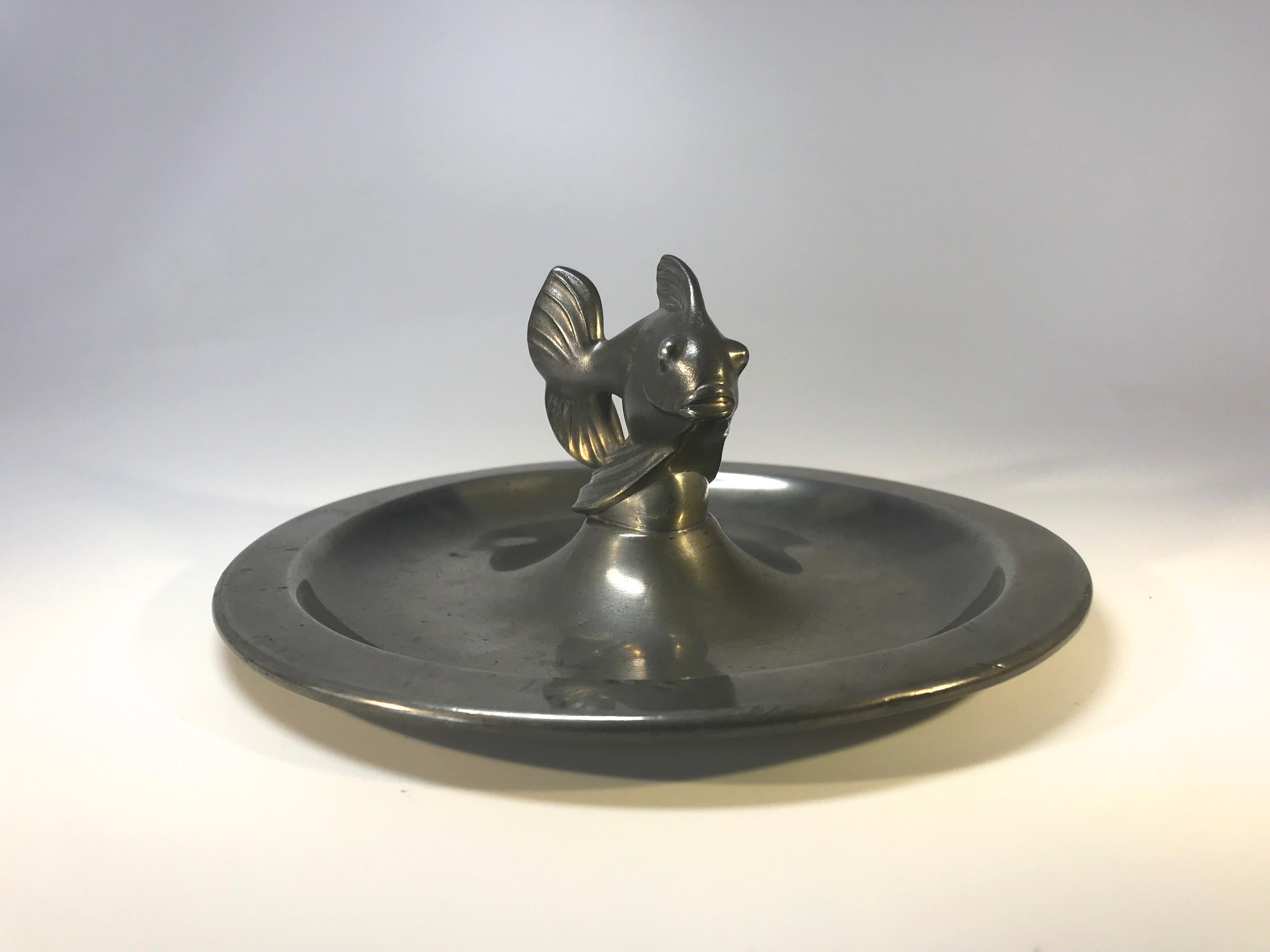 Just Andersen, Denmark 1930s Art Deco pewter stylized fish vide poche,
circa 1930s
Stamped and numbered 1656P on base
Measures: Diameter 6 inch, height 2.5 inch
Remarkably good condition and patina. Surface wear typical of age.
  