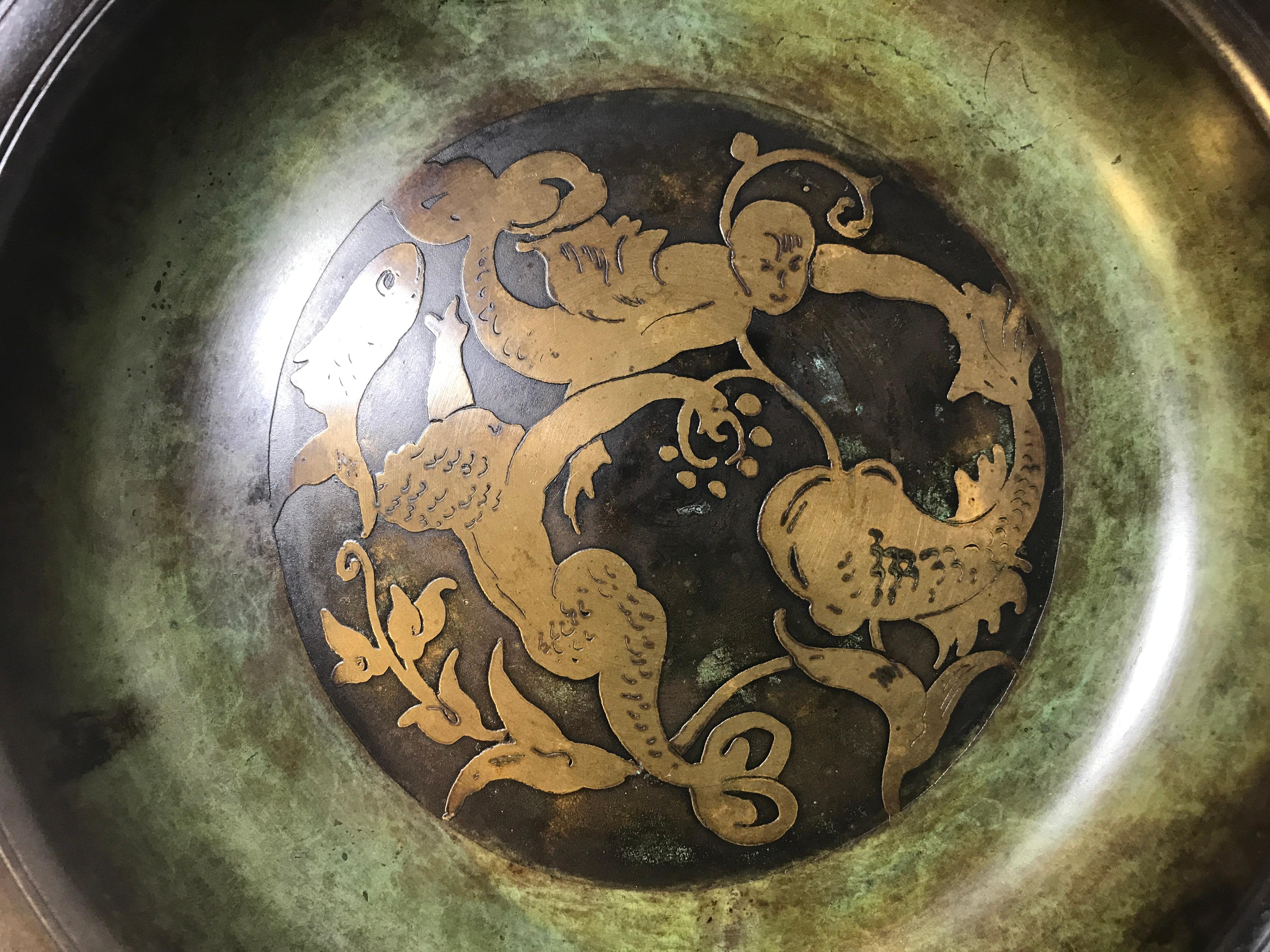 Just Andersen of Denmark, Art Deco bronze shallow bowl inlaid with stylized Merman and Mermaid detail #B96
Superb coloring and patination - a delightful piece from Andersen
circa 1920s
Measures: Diameter 7 inch, height 1.25 inch
In very good