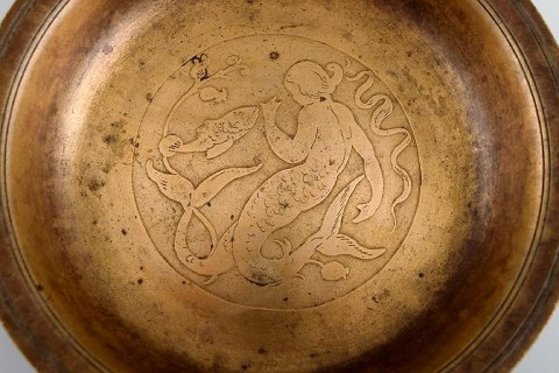 Just Andersen, Denmark. Art Deco dish / bowl in bronze decorated with mermaid. 
Model number B98. 1930s / 40s.
Measures: 18 x 3.5 cm.
In excellent condition with beautiful patina.
Stamped.