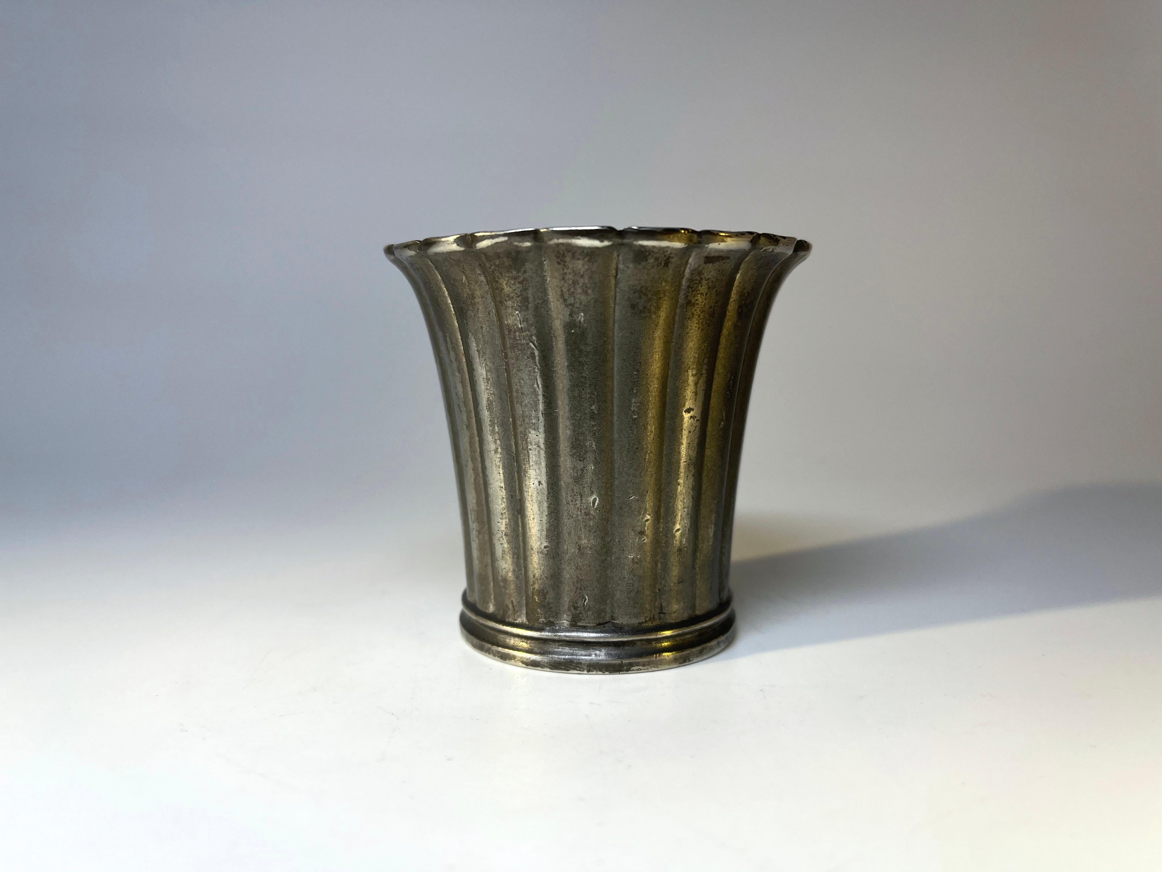A petite Just Andersen pewter cache pot with fluted rim
Perfect as a desk accessory or purely ornamental
Stamped and numbered 2352 on base
Height 2.5 inch,  Diameter 2.75 inch
In very good condition 