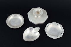 Just Andersen, Denmark. Collection of three small pewter dishes and candlestick.