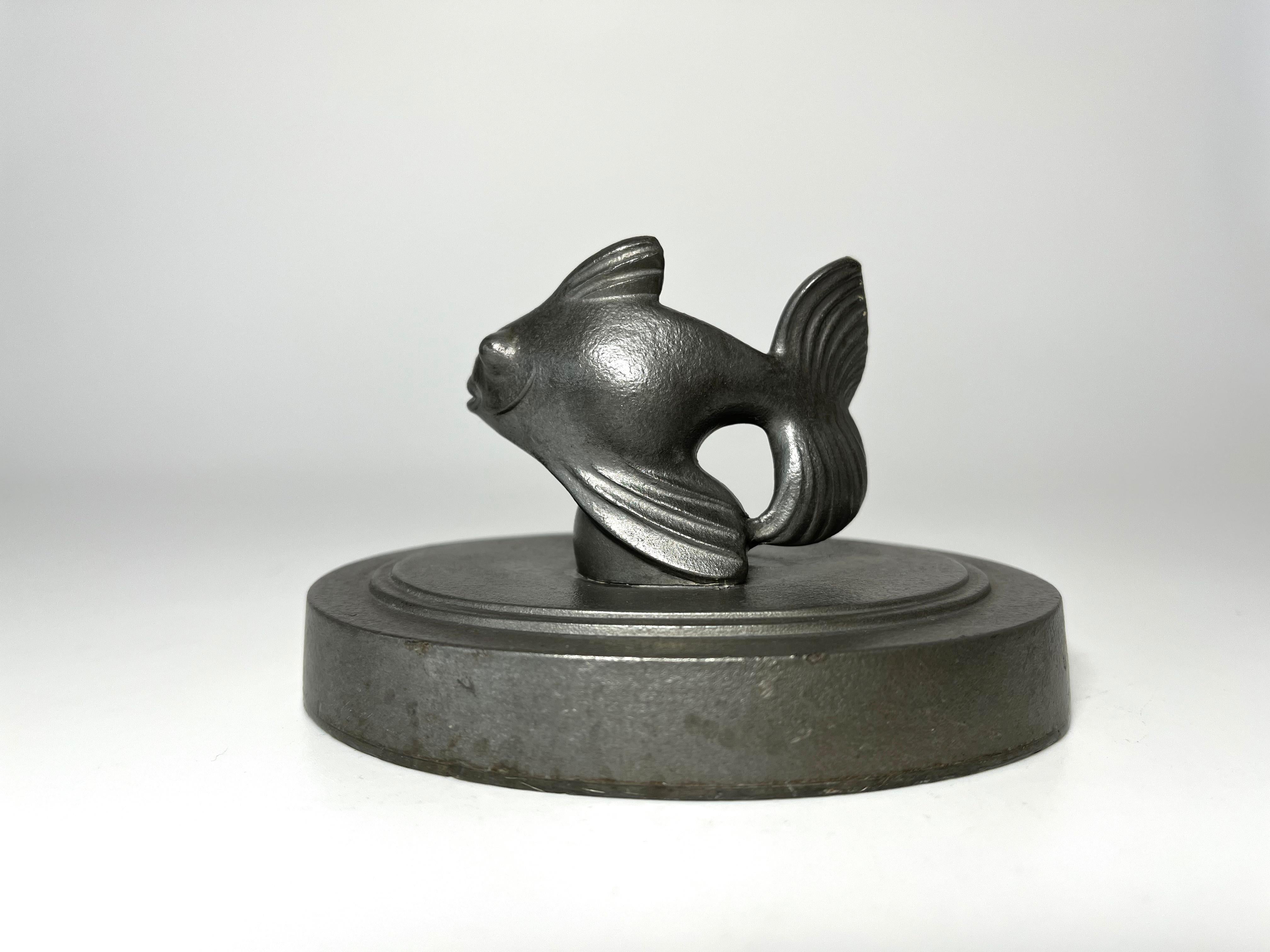 Art Deco stylised Fantail Fish pewter paperweight by Just Andersen of Denmark. 
Circa 1920
Height 2.5 inch, Width 4.25 inch, Depth 3.15 inch
Stamped and numbered 833B to base
Good condition. surface marks to be expected of this well used piece
    
