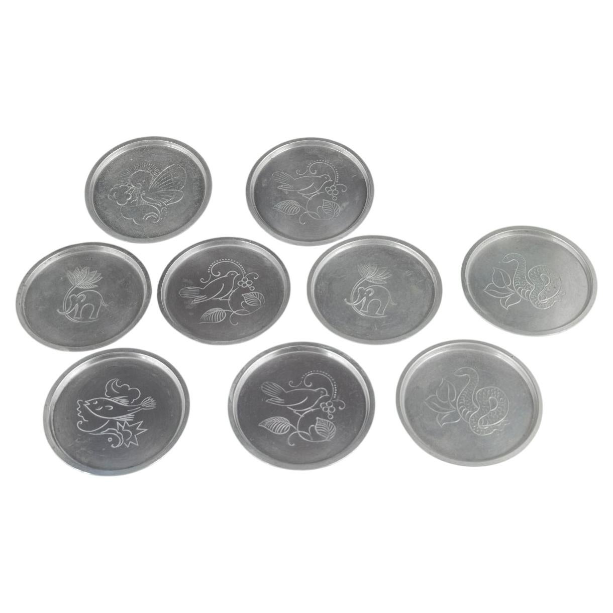 Just Andersen, Denmark. Nine coasters in pewter with animal motifs. 1930s