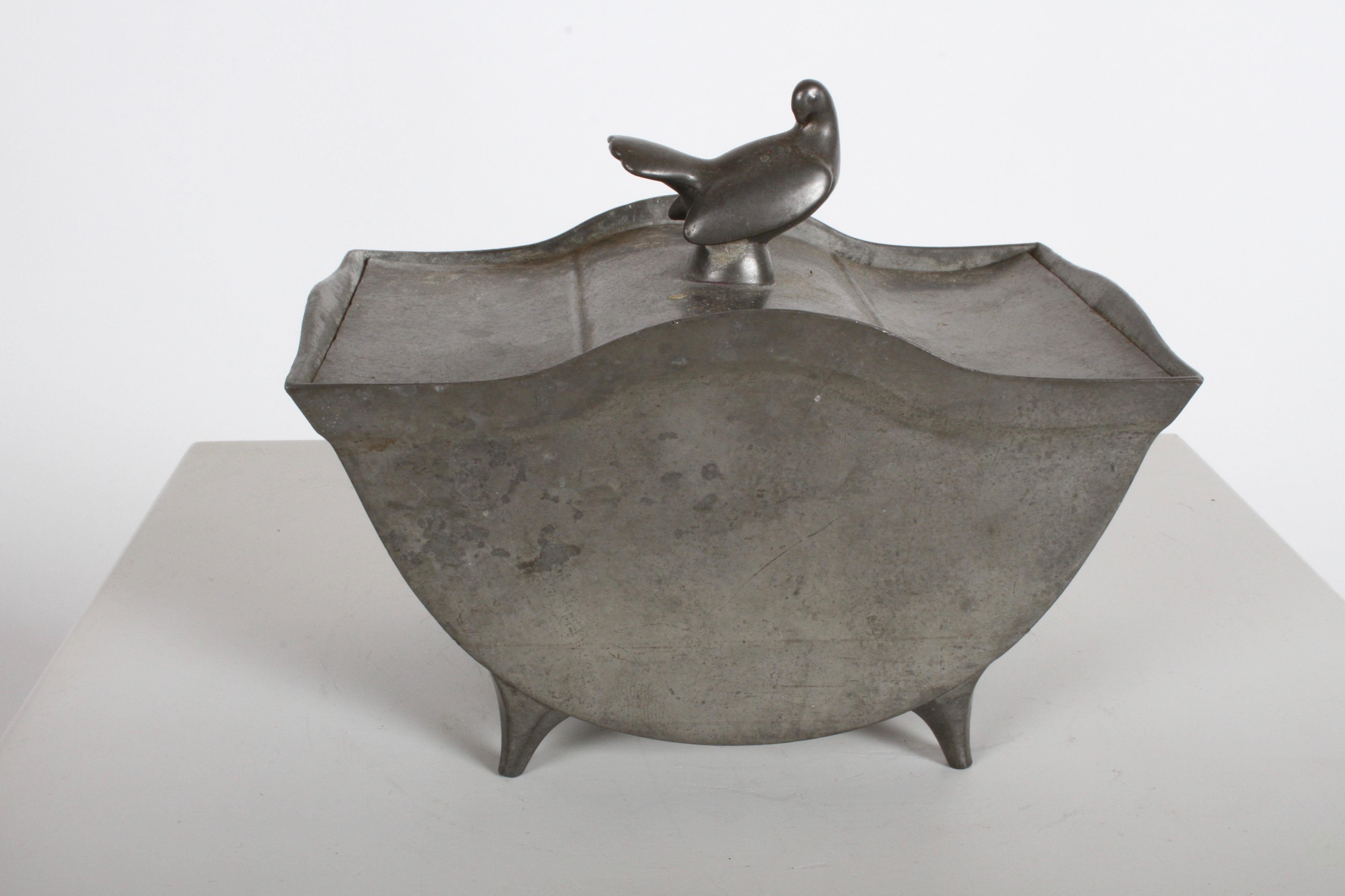 Sculptor Just Andersen Denmark designed covered box in pewter, footed form with curved sides and ornamental dove bird in repose on lid, stamped 
