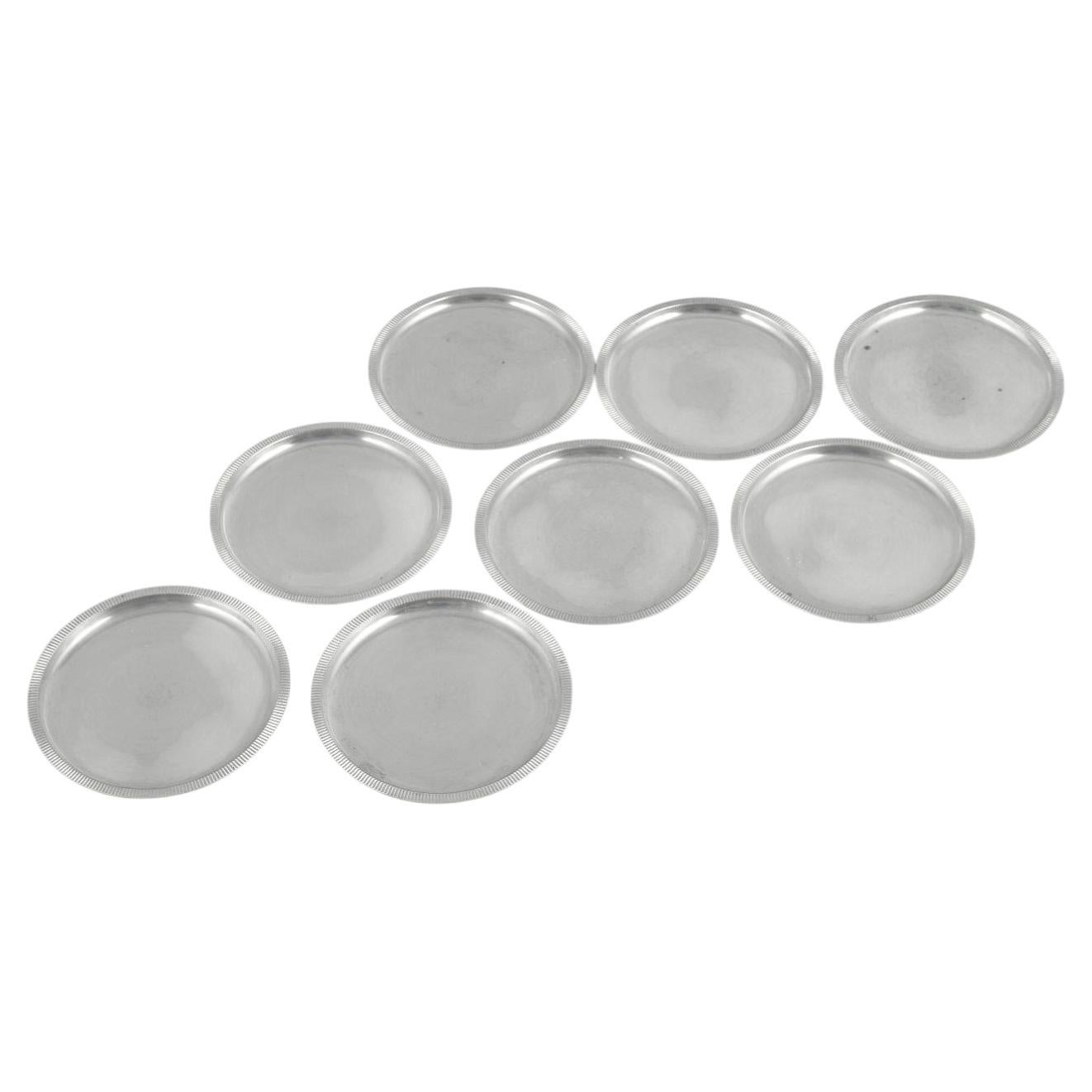 Just Andersen, Denmark. Set of eight coasters in pewter with fluted rim. 1930s
