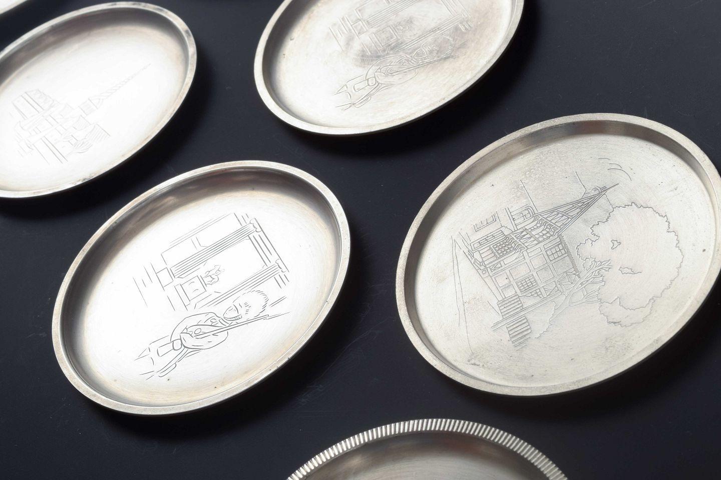 Danish Just Andersen, Denmark. Set of seven pewter bottle coasters, 1930s/40s For Sale