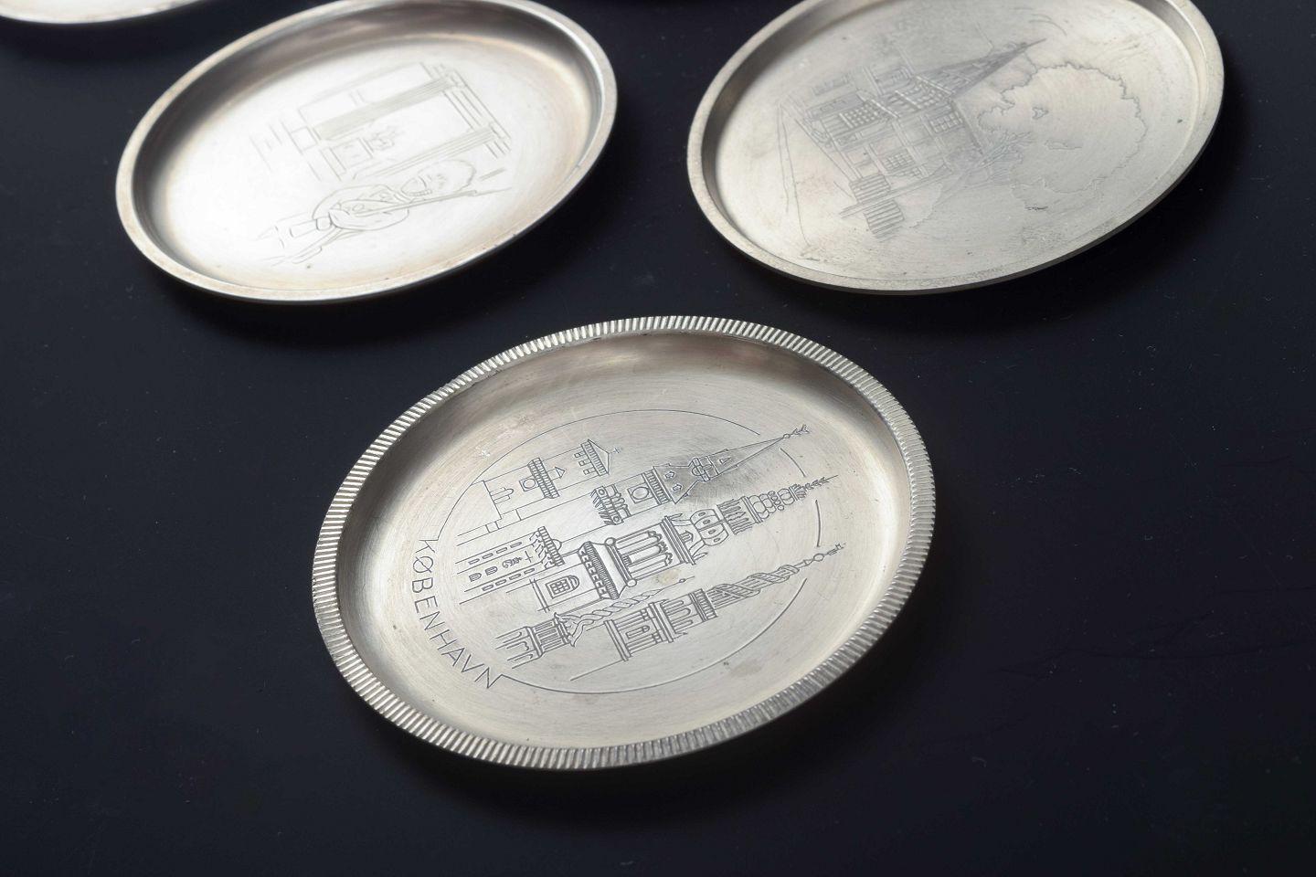 Just Andersen, Denmark. Set of seven pewter bottle coasters, 1930s/40s In Good Condition For Sale In K�øbenhavn, Copenhagen