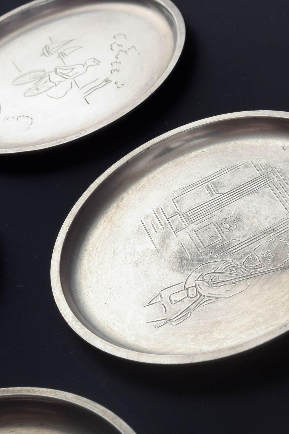 Mid-20th Century Just Andersen, Denmark. Set of seven pewter bottle coasters, 1930s/40s For Sale