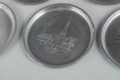Just Andersen, Denmark. Six coasters in pewter with Copenhagen motifs. 1930s