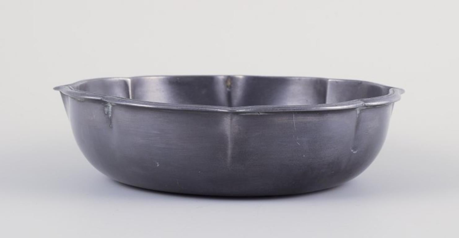 Danish Just Andersen. Early and rare tin bowl. Elegant design with wavy rim. 1920s For Sale