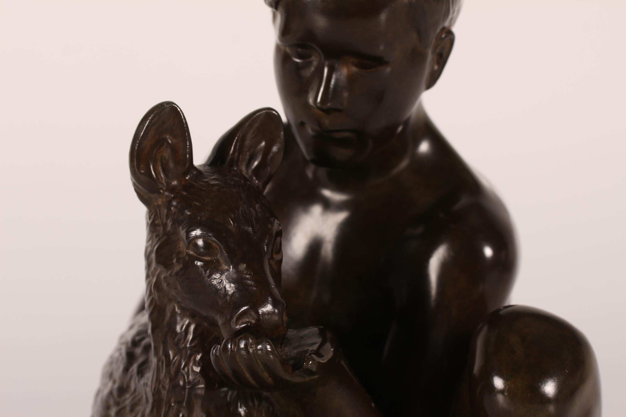 Original figurine designed by Danish artist and sculptor Just Andersen (1884-1943) featuring a young shepherd feeding a lamb.
It's made in Denmark in the 1940s or 1950s of Just Andersens own disco metal with brown patina.
Sign. Just A. + model