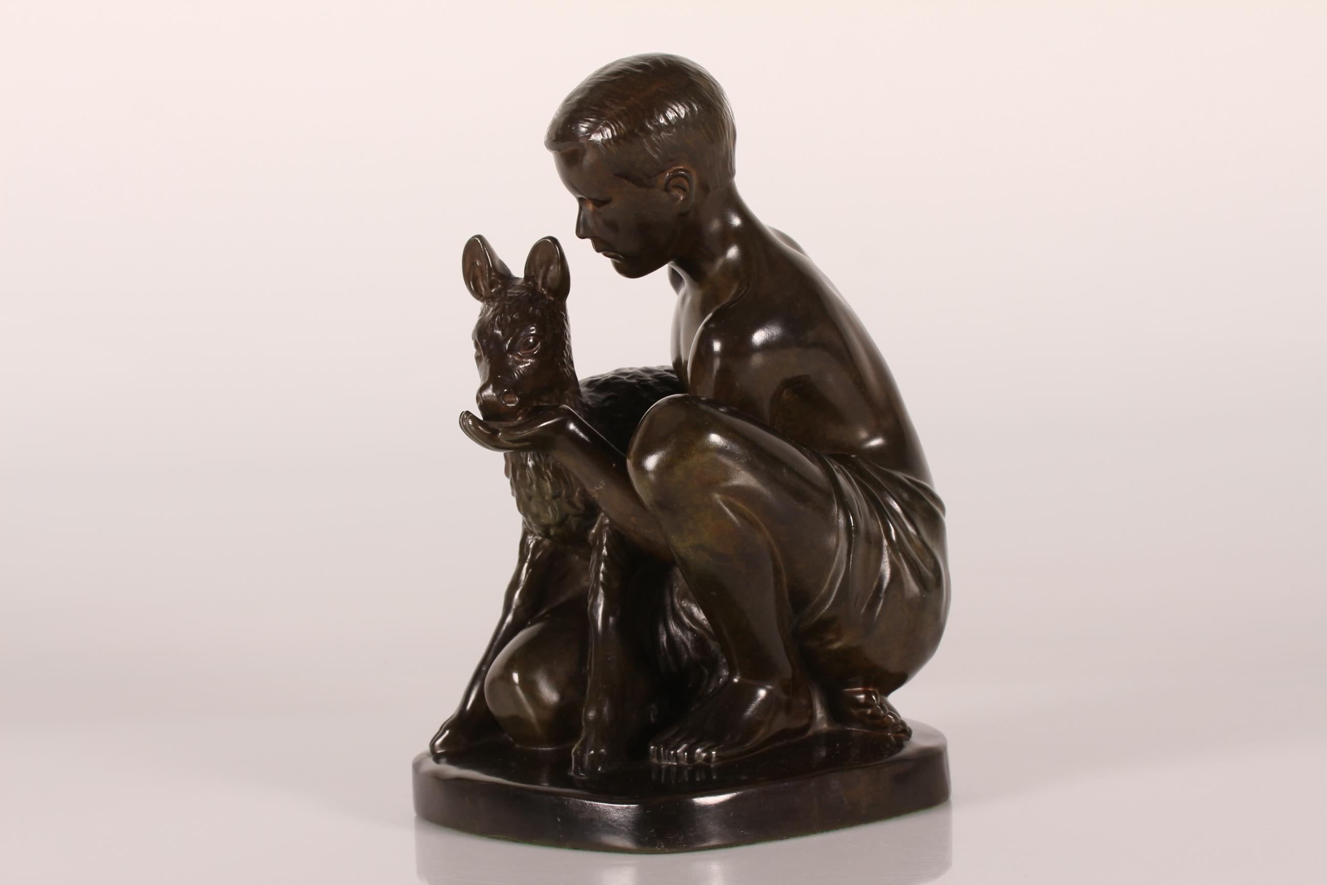 Original figurine designed by Danish artist and sculptor Just Andersen (1884-1943) featuring a young shepherd feeding a lamb.
It's made in Denmark in the 1940s or 1950s of Just Andersens own disco metal with brown patina.
Sign. Just A. + model D2313