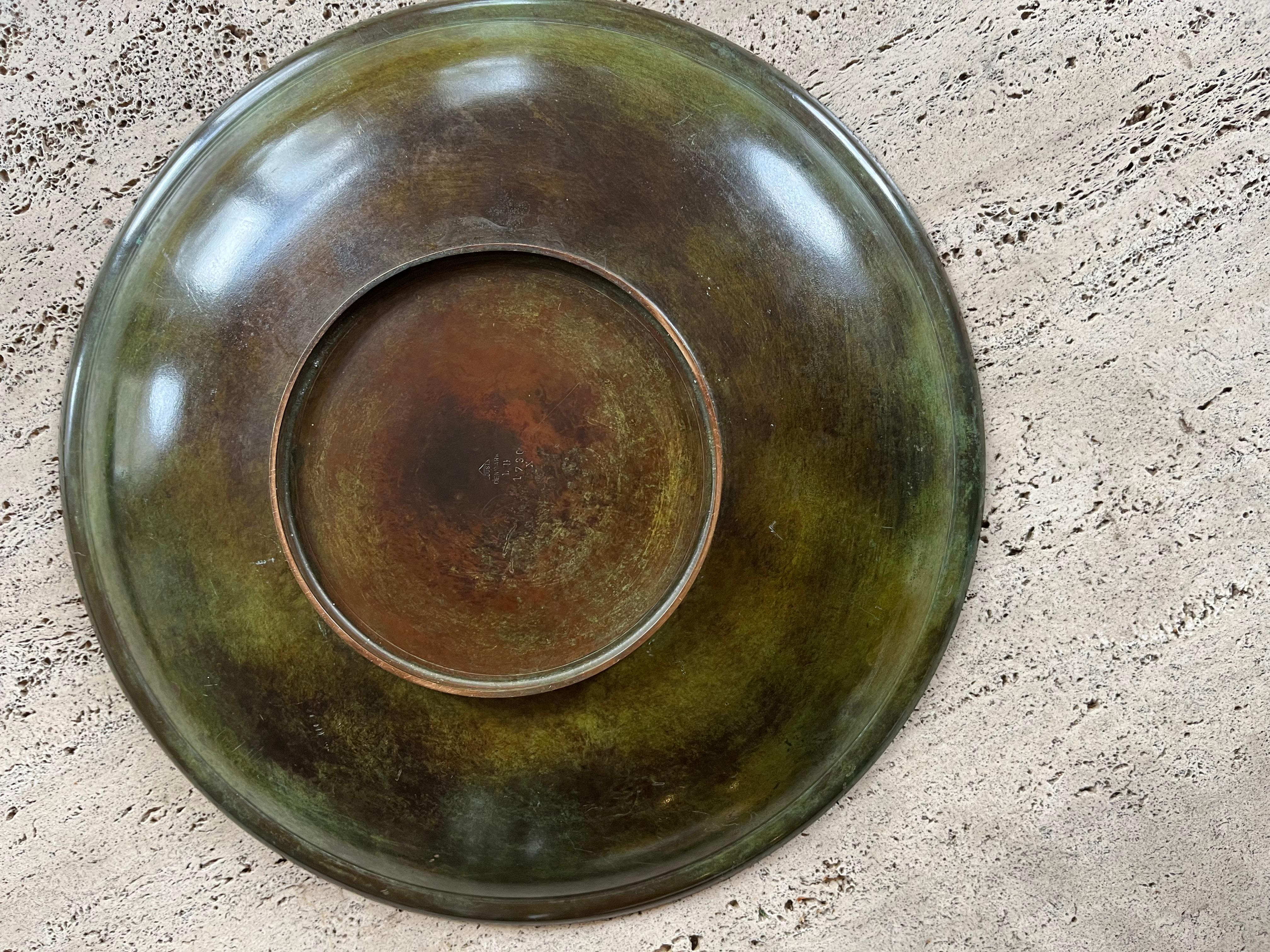 A large alloyed bronze patinated dish bowl stamped Just Andersen Denmark and numbered 1736 X. Some wear to the patination which should be visible in the photos but otherwise a larger than average example of his work. Fabulous quality.