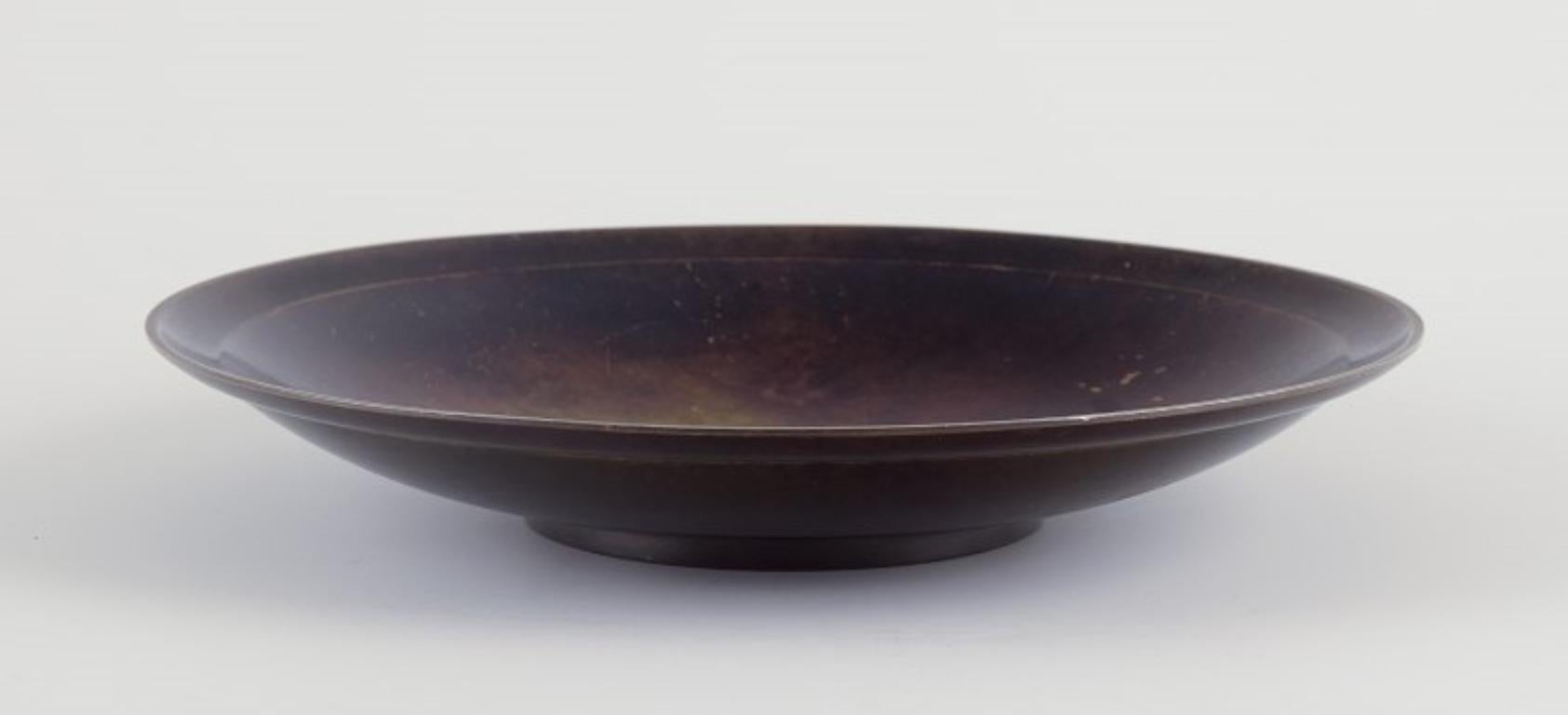 Pre-owned goods are exempt from import duties for U.S. customers. 
Therefore, no import tariffs will be applicable to your purchase.

Just Andersen (1884-1943).
Large circular Art Deco bowl in patinated bronze.
Beautiful patina.
Model number: