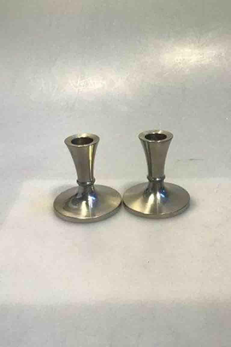 Just Andersen Pewter Candlesticks No 2729(2). Measures 7.5 cm(2 61/64 in)

Great condition.
 