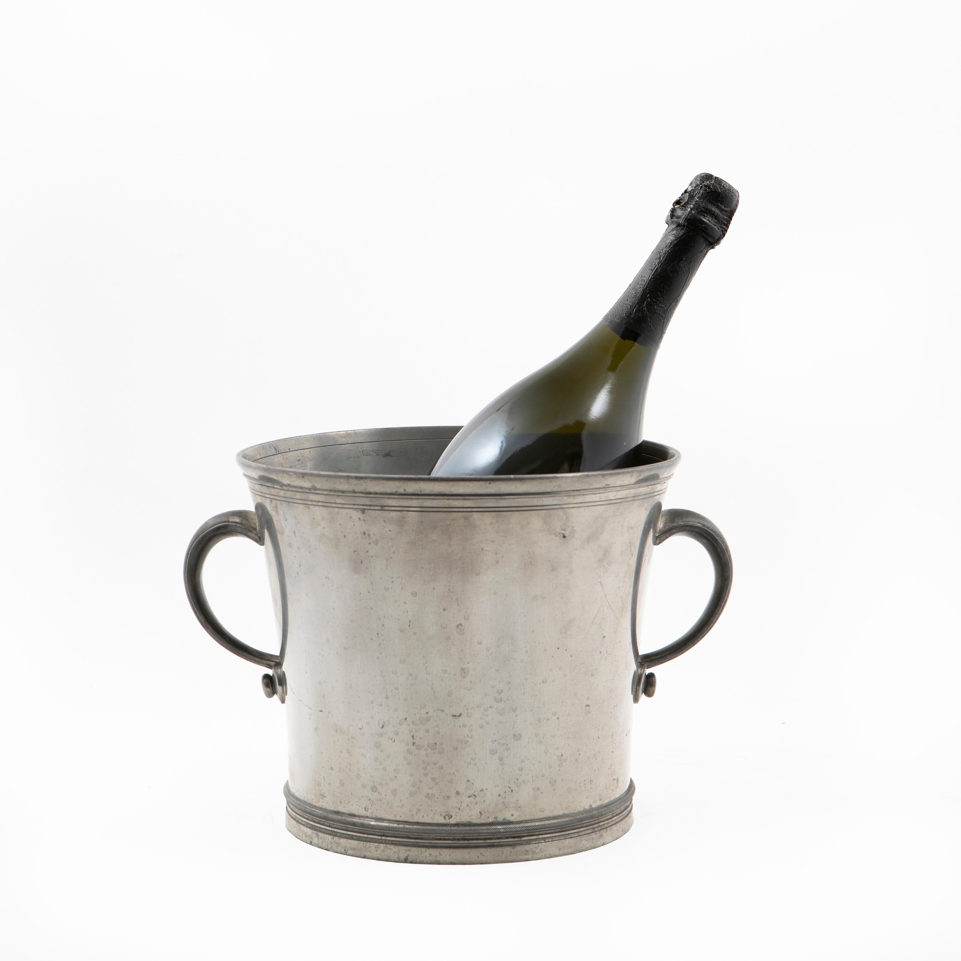 Just Andersen pewter wine cooler / ice bucket with handles.
Stamped JUST and numbered 1912 on base.

Given as a gift with the inscription:
