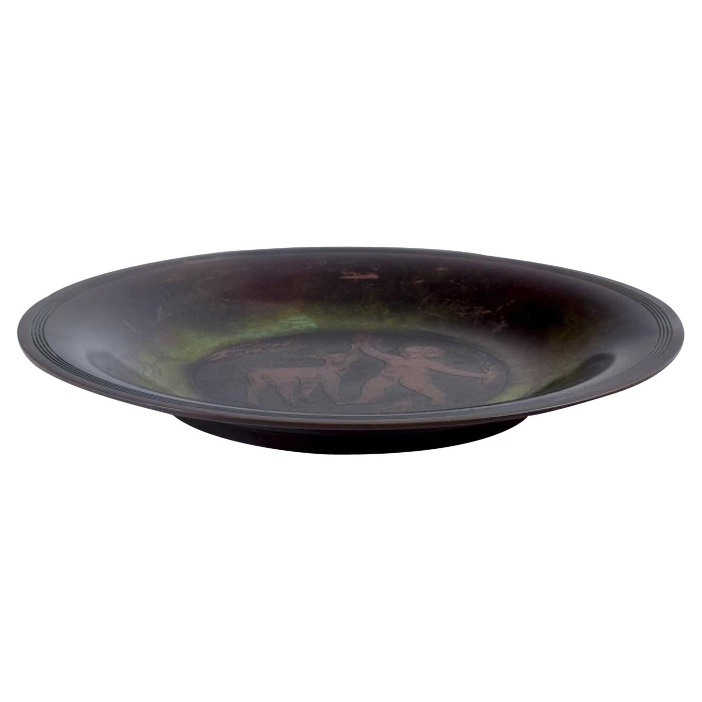 Just Andersen. Rare bronze dish. With a motif of boy and goat kid. For Sale