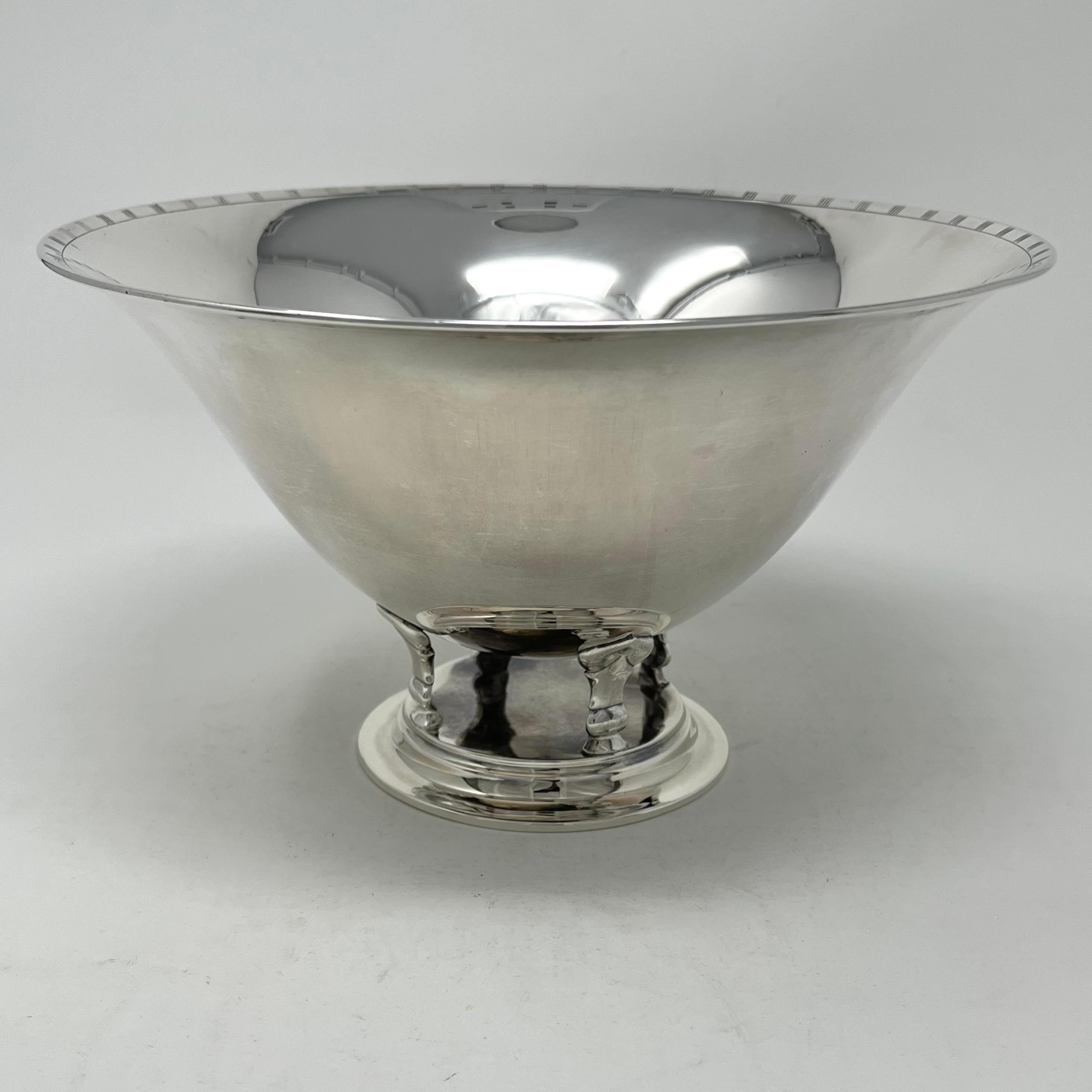 Just Andersen Art-Deco footed bowl with decorated rim. It is simply designed on an integral pedestal base and supported by four stylized pillars. It was designed and made by one of the leading designers in metal ware during the period. While bronze,