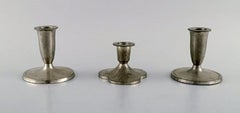 Just Andersen, Three Candlesticks, Eight Bottle Trays and a Mug in Pewter