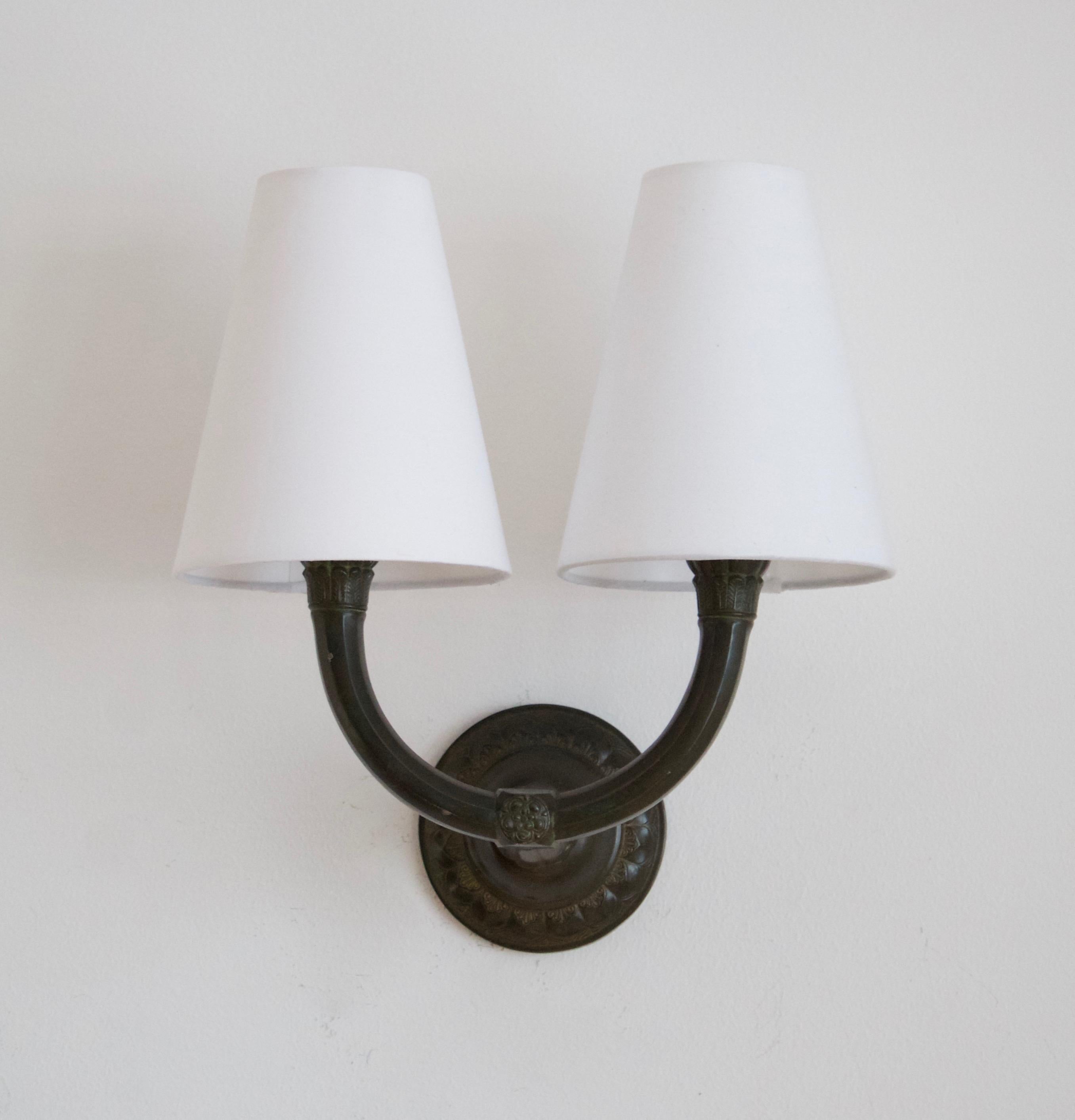 A pair of 1930s wall lights by Just Andersen, Denmark. Stamed 