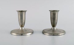 Just Andersen, Two Candlesticks, Eight Bottle Trays and a Mug in Pewter