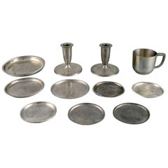 Just Andersen, Two Candlesticks, Eight Bottle Trays and a Mug in Pewter