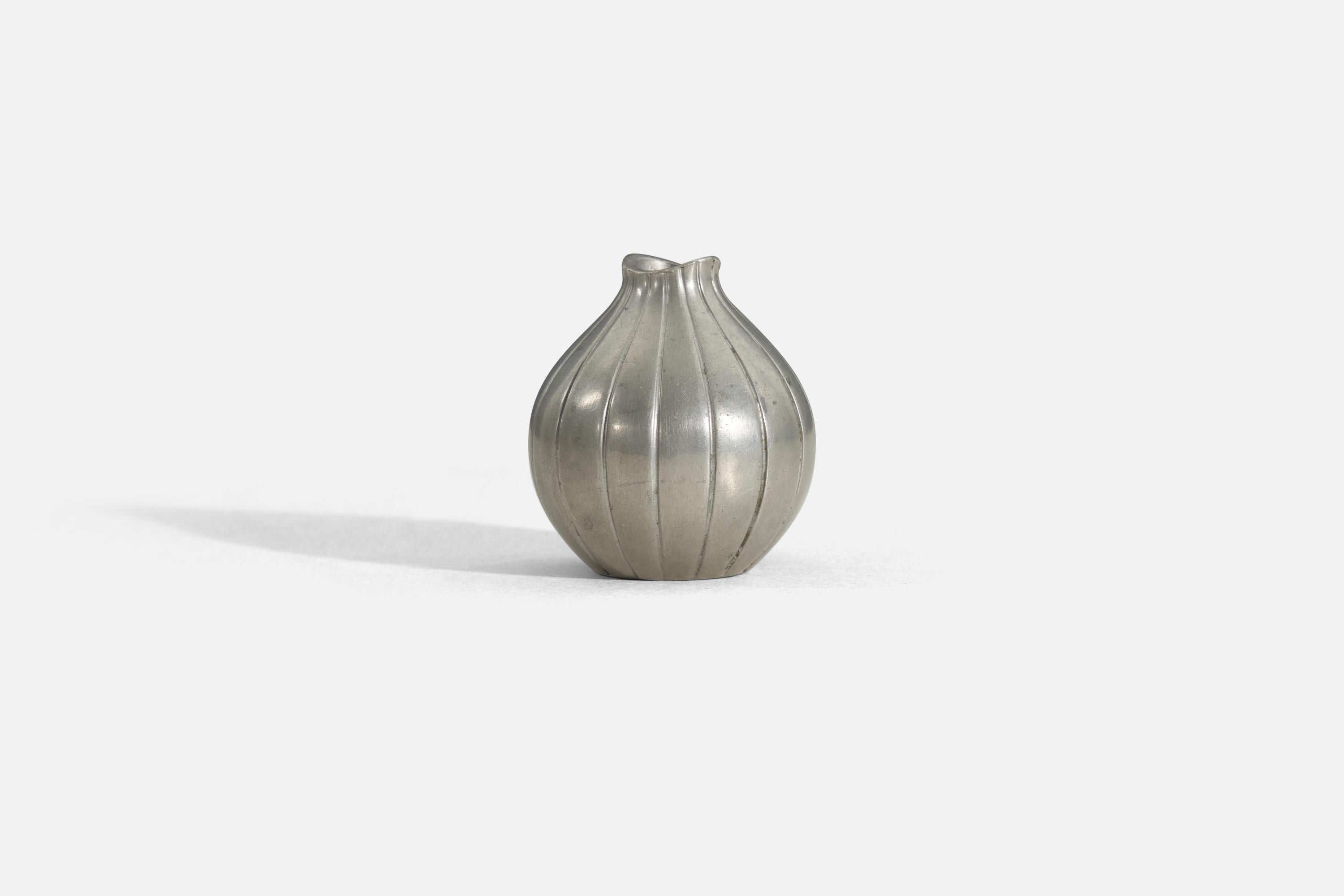 A small pewter vase by Just Andersen, Denmark. Base marked 