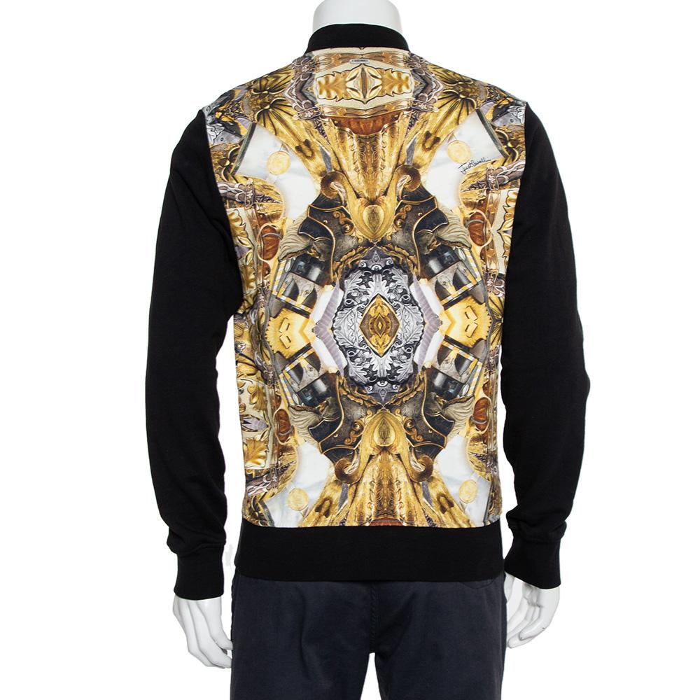 This jacket hails from the house of Just Cavalli and embodies the unique aesthetic of the popular brand. It has been crafted from cotton and carries a black hue. The jacket is styled with a 'duel' print, a zip front, long sleeves and two pockets.

