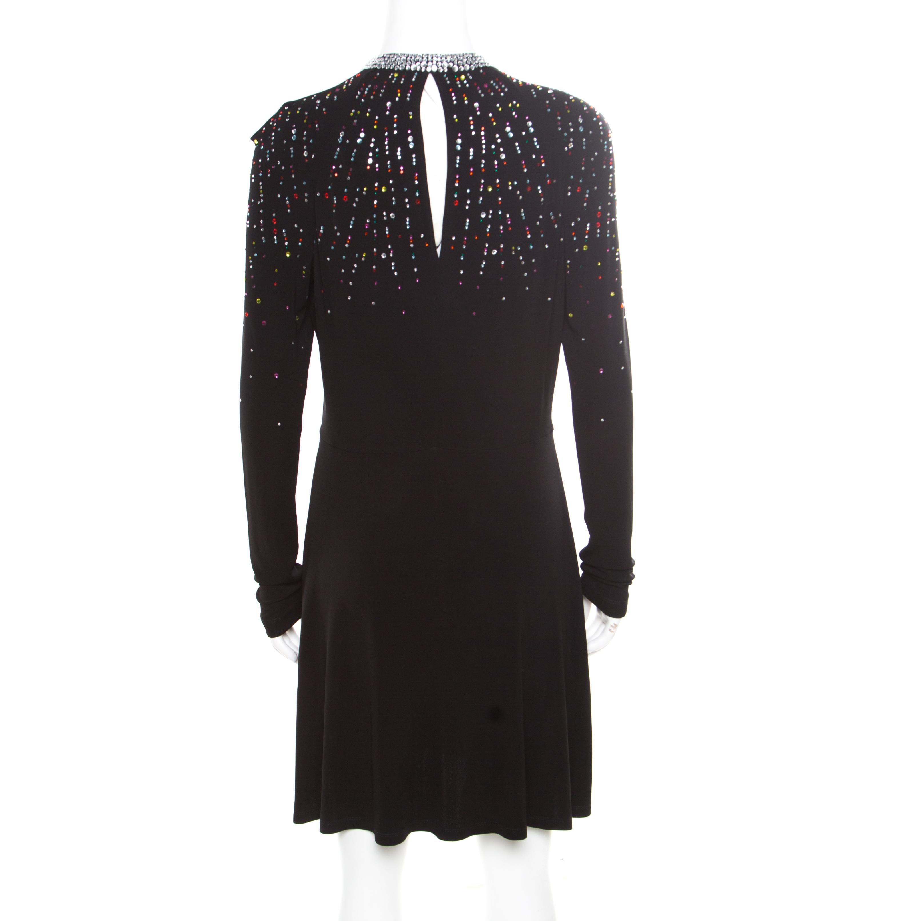 This gorgeous dress from Just Cavalli deserves to be worn by a diva like you! The black knit creation is made of a viscose blend and features a flattering feminine silhouette. It is artistically embellished with multicolour crystals and flaunts a