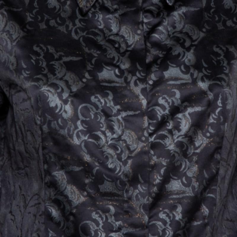 Highlighting the best trends of the season, this top is from Just Cavalli. This chic black shirt exhibits a well-balanced combination of comfort and vogue in its design. Cut from satin, this posh top is fine great for evening events.