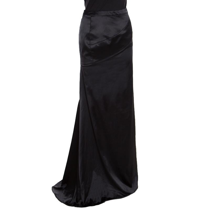 From Just Cavalli comes this maxi skirt crafted in a straight silhouette with flattering floor-sweeping length. It is adorned with a classic black hue and features a subtle drape detail near the waistline. It is crafted from silk and will look great