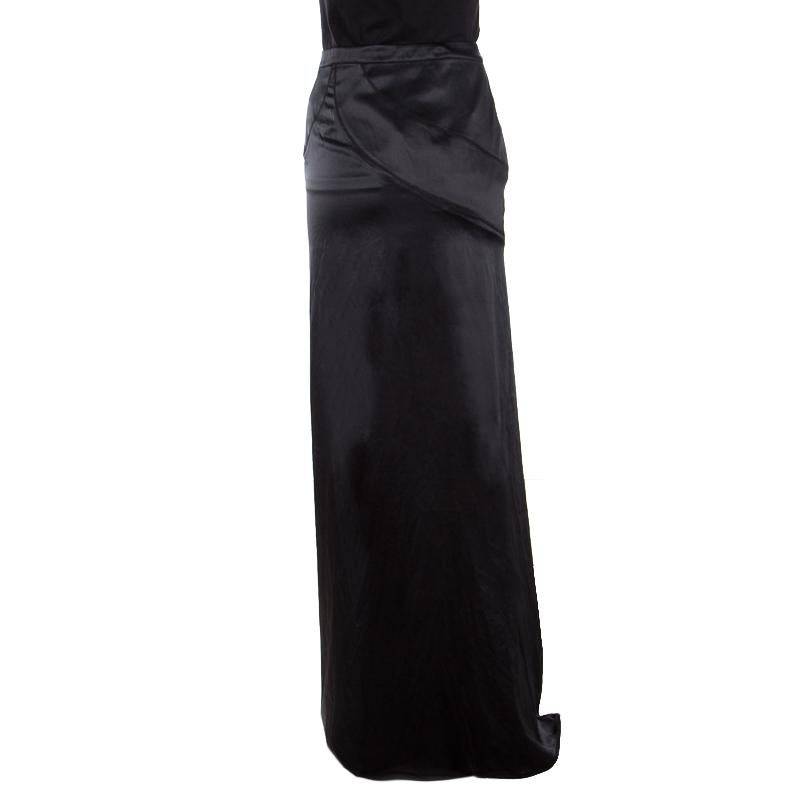 From Just Cavalli comes this maxi skirt crafted in a straight silhouette with flattering floor-sweeping length. It is adorned with a classic black hue and features a subtle drape detail near the waistline. It is crafted from silk and will look great