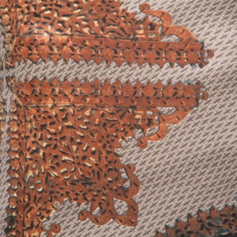 From Just Cavalli, this is yet another awesome top for you to show off your stunning look. If you're looking for a laid-back vibe with a hint of glamour, then this beige & brown-hued top is perfect for you. It is crafted from a cotton-blend knit