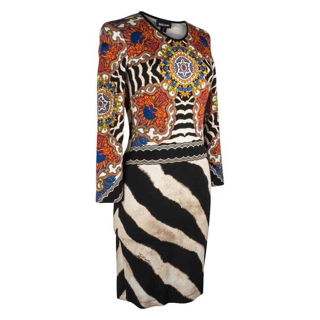 Guaranteed authentic Just Cavalli dress features bold zebra print. 
Upper front and sleeves have a vivid floral and abstract print in blue green and orange.
Long sleeve with scoop neck.
Fabric is viscose and elastane.
  
SIZE 40
USA SIZE 6

DRESS
