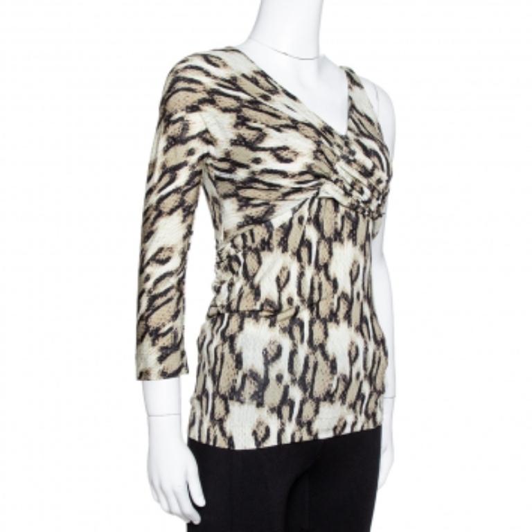 With its feminine aesthetic, Just Cavalli lets you master the subtle art of desk-to-dinner dressing in this top. It has an asymmetrical silhouette and features a snake print all over. The drape details make it look very stylish and it can be paired