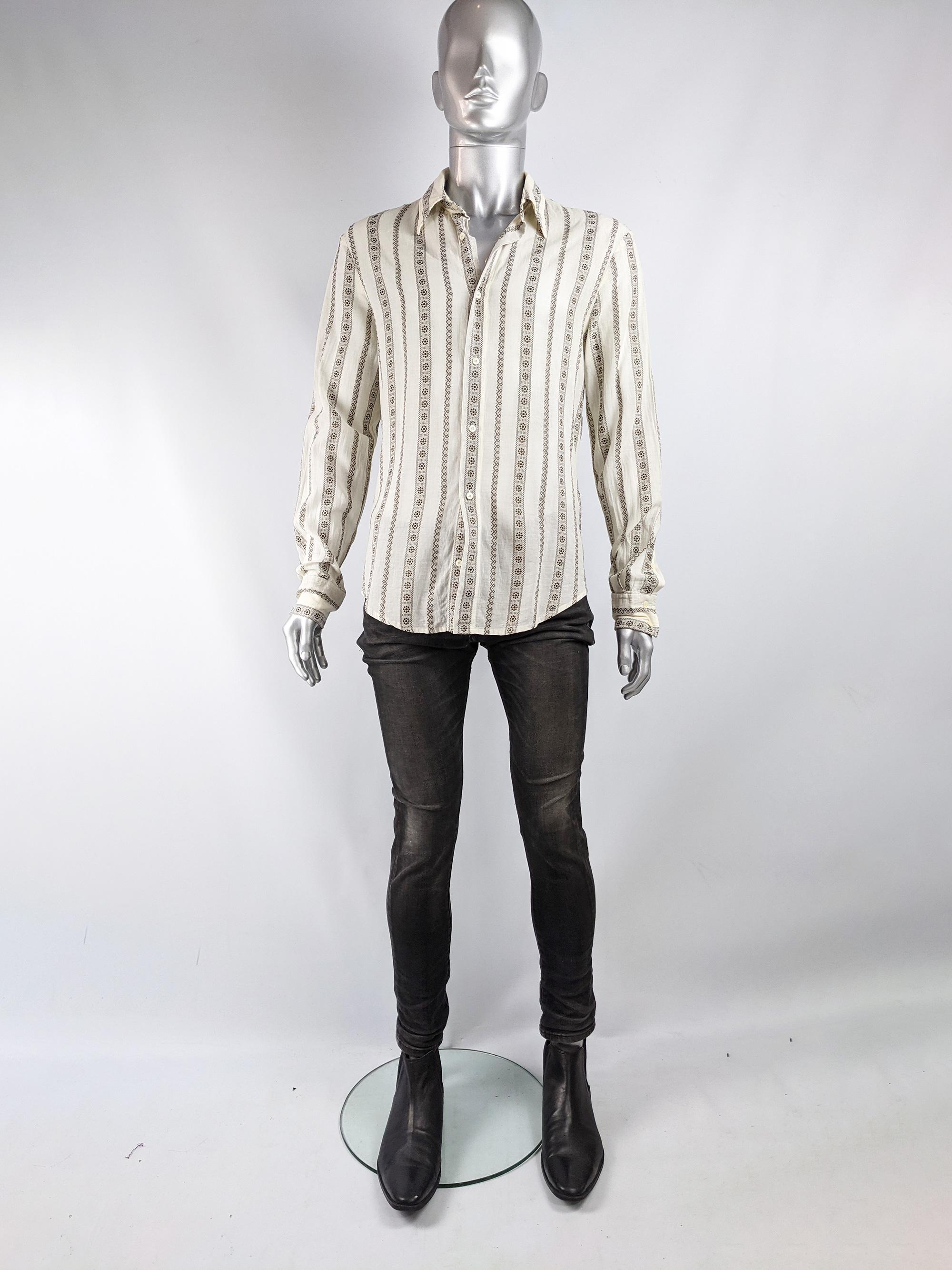 A stylish vintage mens shirt by Roberto Cavalli for the Just Cavalli line, from c. the late 90s. In an off white cotton blend with a brown floral brocade pattern throughout creating a boho style look. 

Size: Marked IT 50 which equates to a mens