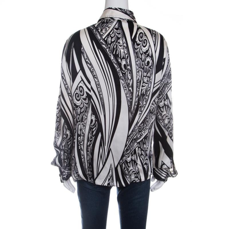 Lovely in a simple way, this Just Cavalli blouse will be a perfect addition to your closet. It comes tailored from silk and designed with monochrome prints, long sleeves with cuffs and front button closure.

Includes: The Luxury Closet Packaging

