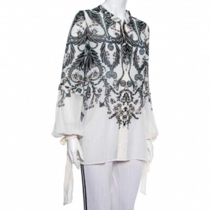 This designer top by Just Cavalli skillfully merges fine craftsmanship and simple design with an elegant silhouette. The women's top has front button closure, beautiful prints, and long sleeves with ties.