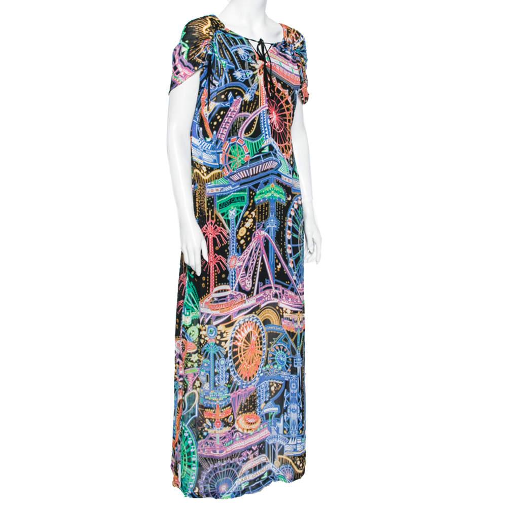 Look pretty and poised as you wear this maxi dress from Just Cavalli! It is stitched luxuriously using multicolored printed chiffon fabric and features a side slit detail. It has a tie detail on the front and short sleeves. Wear this dress and let