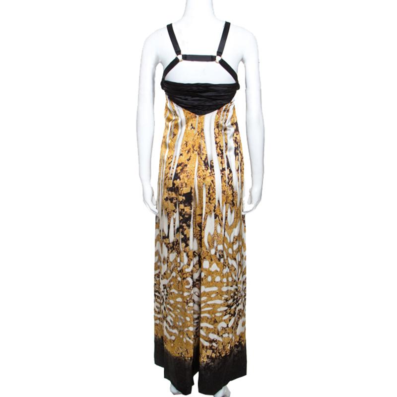 This Just Cavalli maxi dress is characterised by its bold silhouette, impressive print and the pleated bodice. This dress will add a touch of stylish flair to your look. It is cut from soft silk fabric and is secured with zip fastening.

