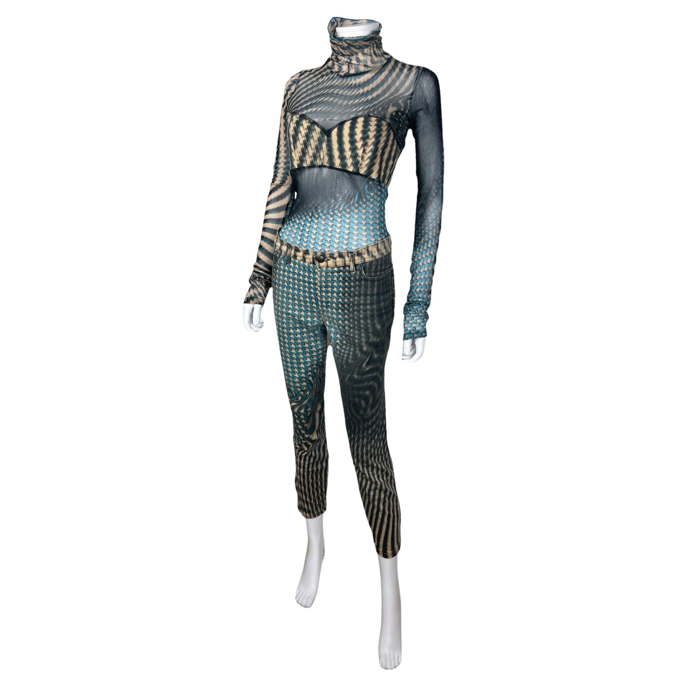 JUST CAVALLI, Made in Italy, circa 2000.
Set composed of a mesh top and capri pants with a psychedelic print. 
The top is sheer, except on the breast. It seems to have been modified on the turtleneck, the seam on the front has been added. Also the