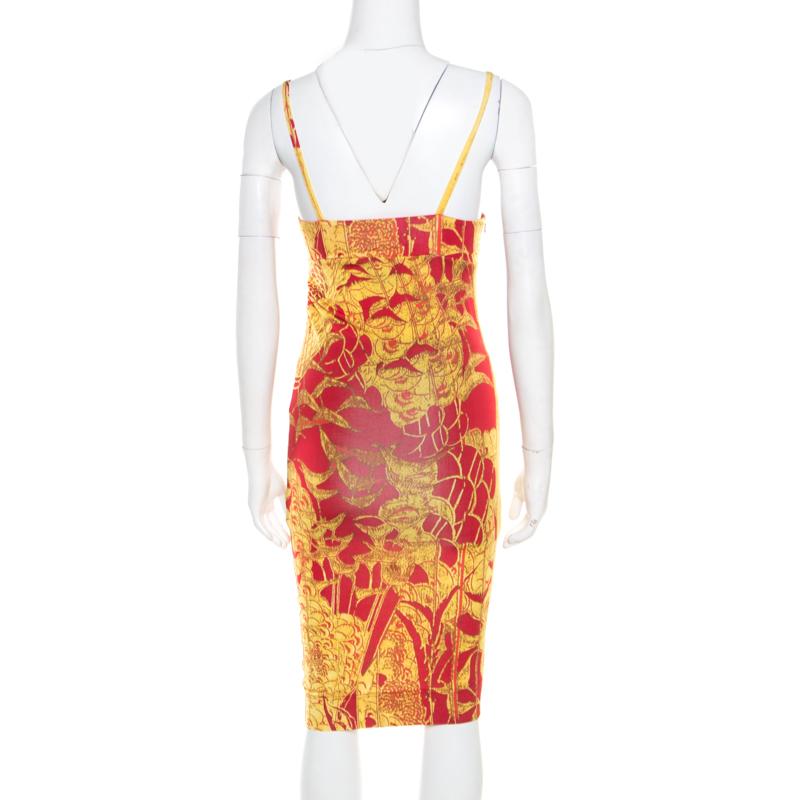 The red and yellow dress by Just Cavalli comes in a beautifully printed design. The sleeveless midi dress has a twist detail on the front and is comfortable to wear. This fitted dress can be worn with a pair of sneakers or ankle strap