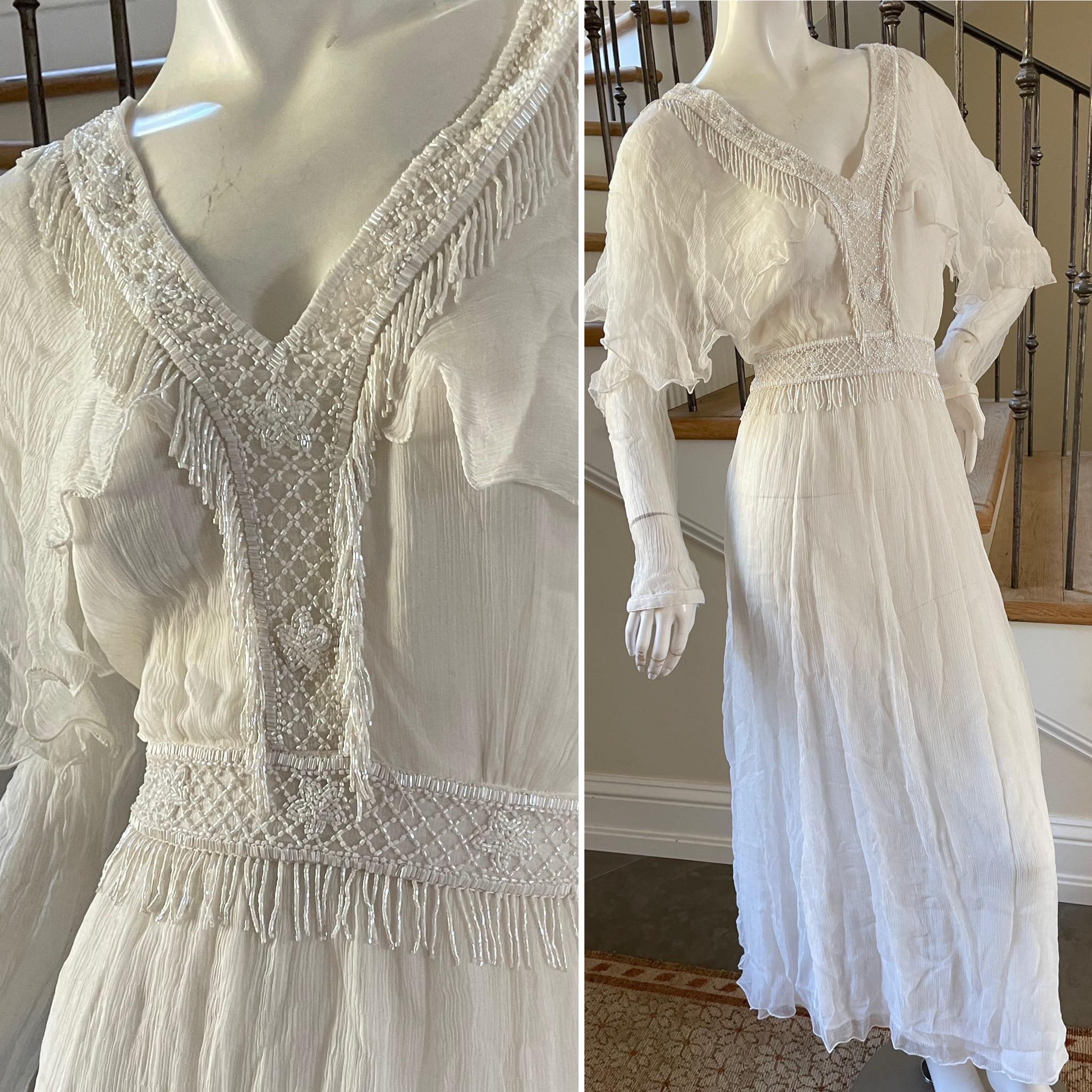 Just Cavalli Romantic Diaphanous White Dress with Bead Fringe by Roberto Cavalli .
This would make a nice wedding dress.
NWT
 Sz 44 
 Bust 38