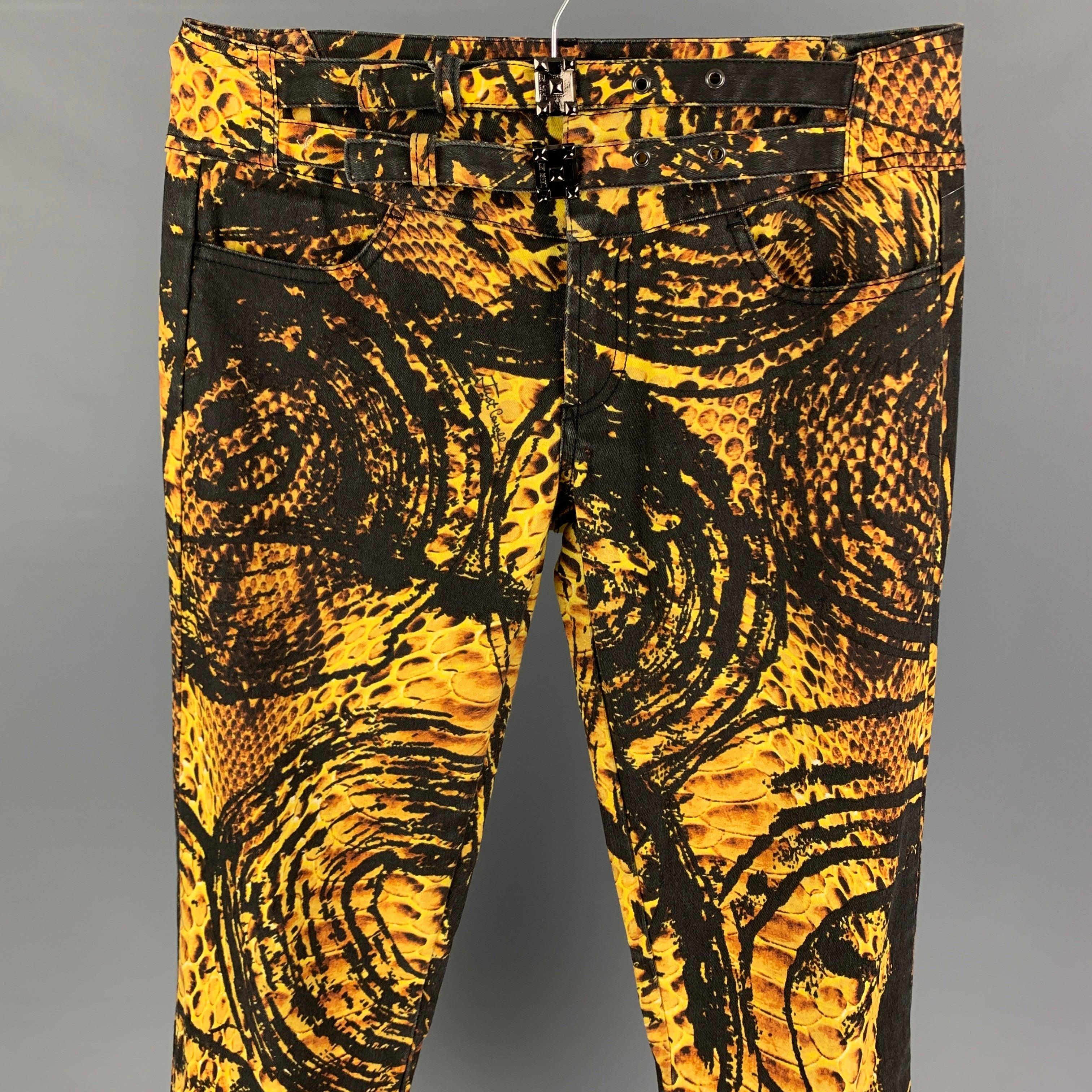JUST CAVALLI pants comes in a yellow & black graphic print cotton featuring a skinny fit, double belt detail, front tabs, and a zip fly closure. Made in Italy.
Very Good
Pre-Owned Condition. 

Marked:   29 43 

Measurements: 
  Waist: 32 inches