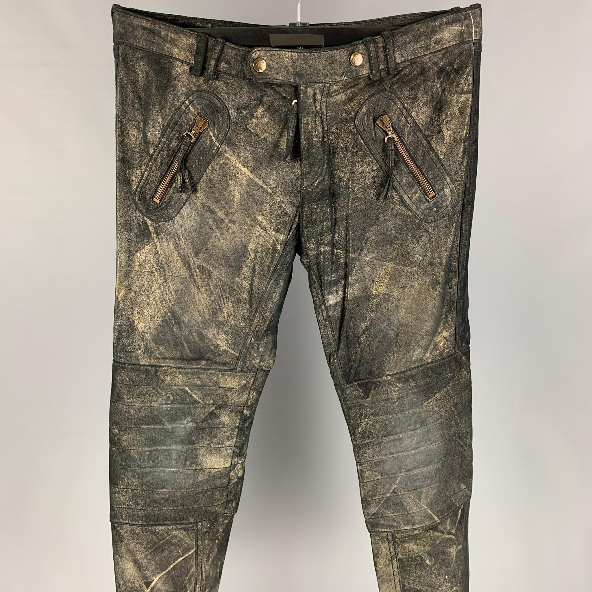 JUST CAVALLI casual pants comes in a black & gold metallic leather featuring a biker style, quilted knee panels, zipper pockets, zip fly, and a double snap button closure. Made in Italy. 

New With Tags. 
Marked: 50
Original Retail Price: