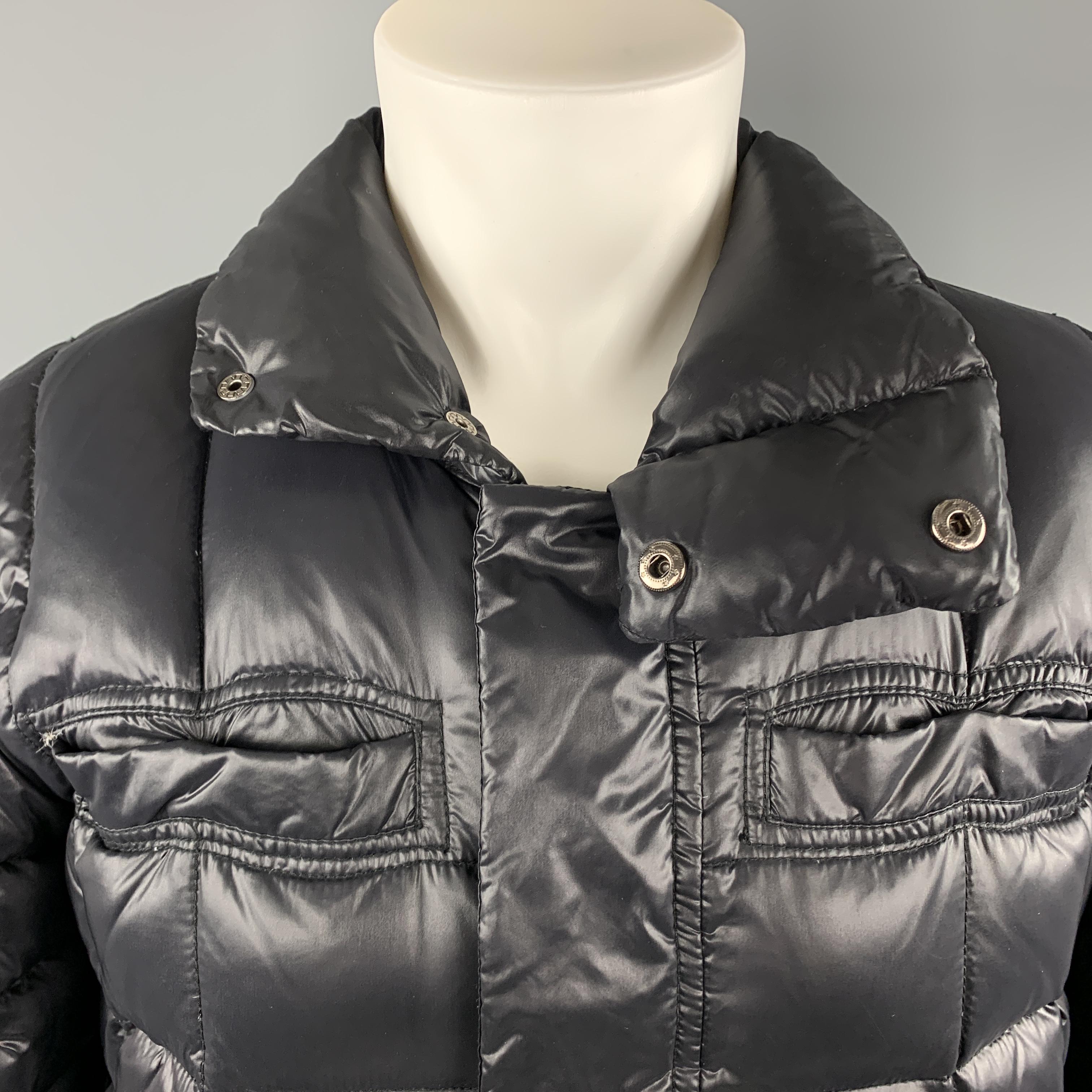 JUST CAVALLI puffer jacket comes in quilted high shine padded fabric with a high collar, chest and snap pockets, and hidden placket zip front. 

Excellent Pre-Owned Condition.
Marked: IT 48

Measurements:

Shoulder: 17 in.
Chest: 44 in.
Sleeve: 25