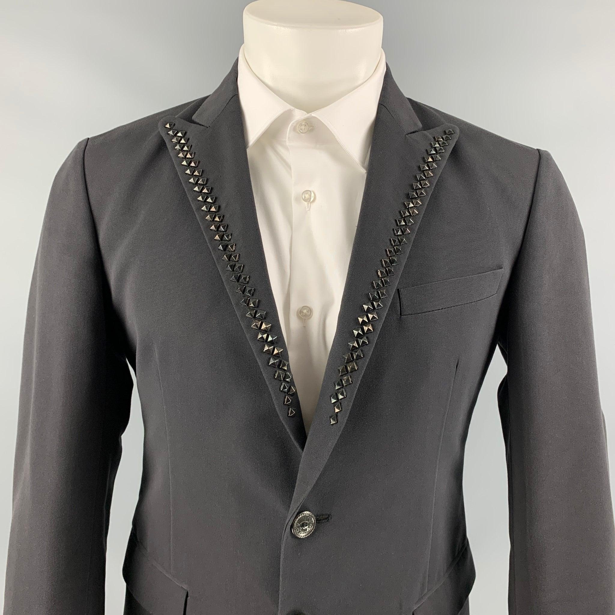 JUST CAVALLI sport coat comes in a black cotton with a full liner featuring a studded peak lapel, single back vent, flap pockets, and a two button closure. Made in Italy.
Excellent
Pre-Owned Condition. 

Marked:   48 

Measurements: 
 
Shoulder: