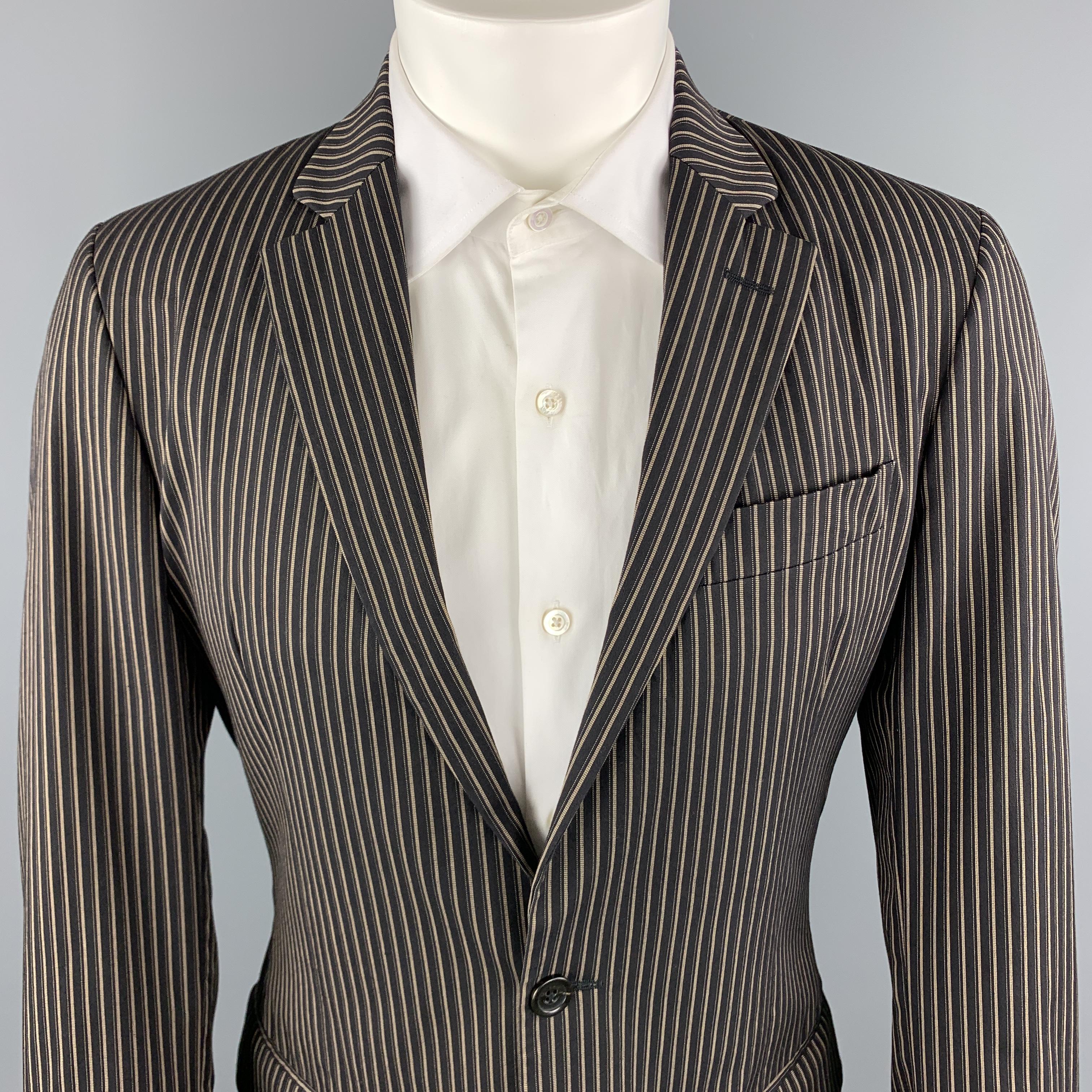 JUST CAVALLI Suit comes in a brown stripe cotton blend material, and includes a single breasted sport coat with a notch lapel and two button front, featuring an animal print lining, with matching flat front trouser, zip fly. Made in